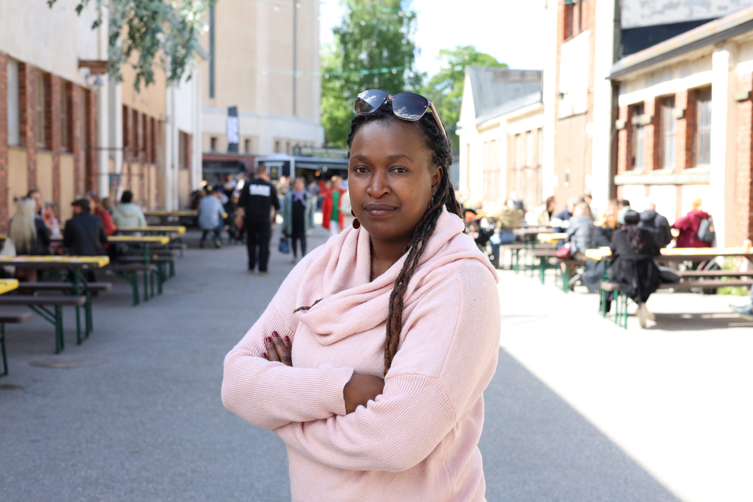 Winnie Masai standing at the World Village Festival.